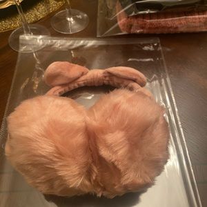 New in Packaging. Women’s Pink Faux Fur Earmuffs with a Bow.